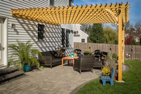 wooden pergola attached to house